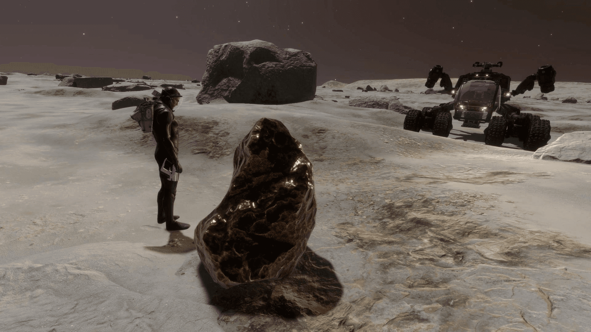 A commander and a Scarab SRV beside a metallic meteorite on a planet surface. - Source Elite Dangerous Wiki